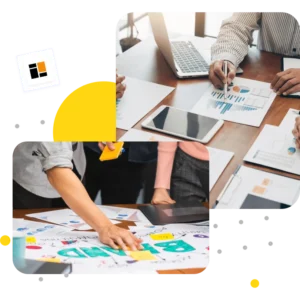 Business team collaborating on a project with charts and digital devices on a conference table, focusing on data analysis and strategic planning | 10 Tech